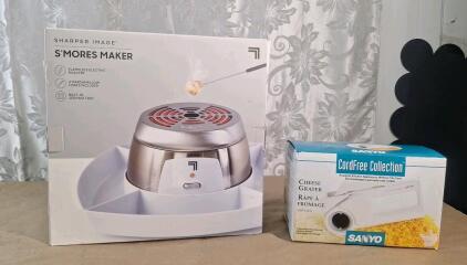(1) Sharper Image Electric Tabletop S'mores Maker & (1) Sanyo Cordless Cheese Grater