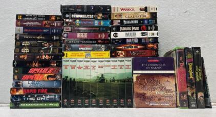 Lot of VHS Movies with many different Titles including movies like Jurassic Park 1994 VHS Tape MCA Universal, Sci-Fi Adventure, Original Case, as well as a few collections.
