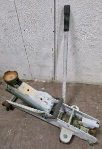 Vintage Manual Trolley Floor Jack, 2 Ton Capacity, Steel Construction, 4 Wheels, No Visible Brand