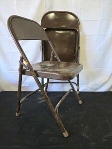 Brown Metal Folding Chair with 480 lb Capacity, Stackable Design, and Rubber Leg Caps