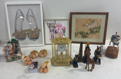 BULOVA elegant table clock, (2) Fashion Themed wall paintings. (4) Egyptian themed statues,(2) pumpkin and cornucopia candle holders. And much more.