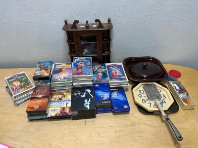 Assorted Disney VHS movies, kitchenware and home decor
