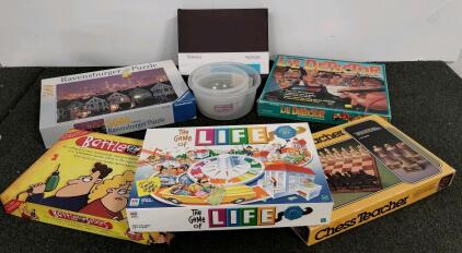 Office Divider, Board games featuring "Battle of the Sexes", "the Game of Life", "Chess Teacher", and "Lie Detector". 5000 piece Ravensburger Puzzle.