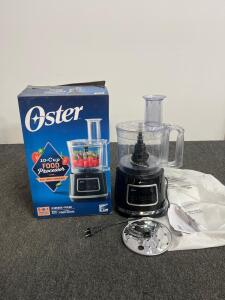 Oster 10-Cup Food Processor, Model FPSTFP1355, 500W, 2 Speeds + Pulse, Includes Attachments, Turned On