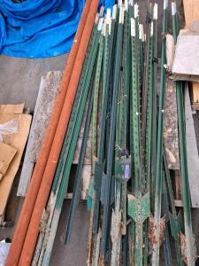 Steel T-Posts approximately(~22) and 2 Wooden Fence Posts &ndash; Approx. 7 ft. Anchor Plates &ndash; Green & Rusted
