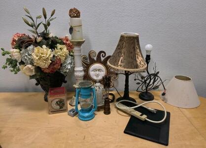 Mixed Lot with Table Lamps, Artificial Floral Arrangement, Sun Face Wall Art, Lantern, Extension Cord