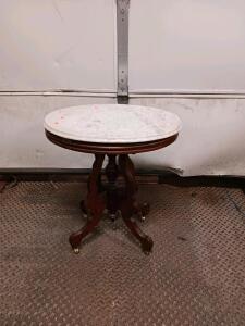Victorian Marble-Top Side Table with Ornate Wooden Base and Brass Casters