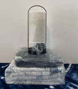 Modern Black Table Lamp, Blue/White Patterned Rug, Gray Faux Fur Blanket Home Decor