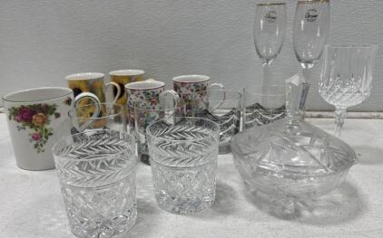 Beautiful paired glass lot featuring a gorgeous crystal dish with matching lid.