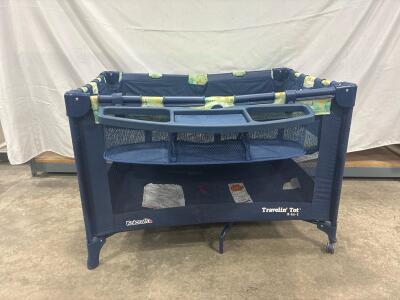 Kolcraft Travelin' Tot 2-in-1 navy blue playard with a removable changing table and mesh sides