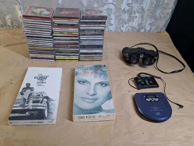 Lot Of (60+) Assorted Music CDs, (1) Portable CD Player W/ Cassette Tape Interface & (1) Pair Of Bushnell Rangemaster Binoculars