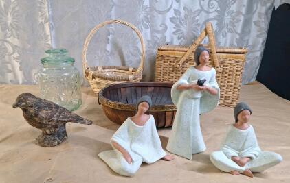 (3) Ceramic Stylized Female Figurenes, (1) Wicker Picnic Basket (2) Decorative Baskets, (1) Decorative Glass Container & (1) Metal Bird Figurene
