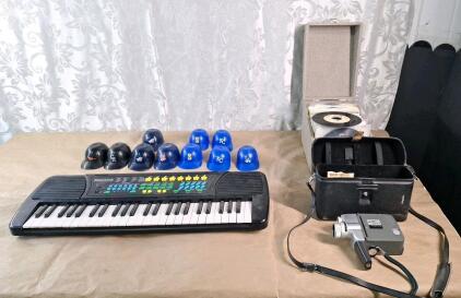 (1) Electronic Keyboard, (1) Vintage Cannon 8mm Video Camera, (1) Box Of 60+ Vintage 7" / 45rpm Dance Music Vinal Records & (10) Assorted Mini Baseball Hard Hats