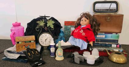 Doll, brass teapot, and more.