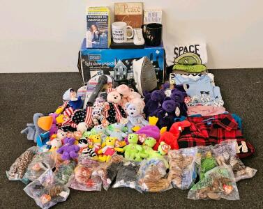 Mixed Decor and Collectibles Lot - Includes: Light Show Projector (Confirmed Functional), 3 Still Sealed Karaoke Mics, Iron (Confirmed Functional), 50 Varied Beanie Babies (All But 1 With Tags Still On), 8 Shirts, 1 Pair of Pants, Two Peppy Mugs, Nancy Dr