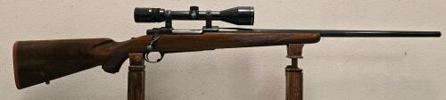 Ruger M77 7MM Rem Mag Bolt-Action Rifle, Walnut Stock, 24" Barrel, Bushnell 4-12x Scope