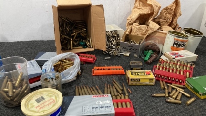 Empty Brass Rounds And a Few Live Rounds