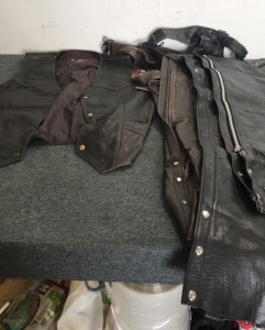 (2) Pairs Of First Leather Apparel Chaps (1) First Leather Apparel Biker Vest