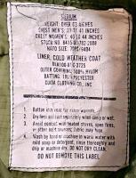 (#3) Mixed Military & Fire Lot: Tan Uniform Shirt, Long Sleeve, Poly-Cotton Blend, Chest Pockets, Button Front, New in Packaging. Firefighter pants, Sleeping Bag Liners (British), Four Pairs of Medium-Short Military Pants, Six Cold Weather Coat Liners - 14
