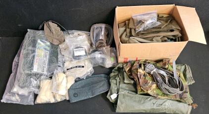 (#4) Mixed Military Lot: Military Camouflage Cover, Casualty Evacuation Bag/Liner, Gas Mask with Replacement Filter, 2 Sets of Camo Yarn, Scarps of Wool for Military Repairs, Swedish Alpine Ski Hats, and More!