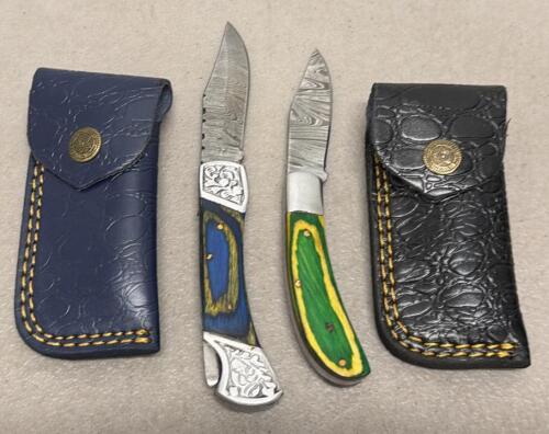 (2) Custom Damascus Folding Pocket Knives with Decorative Handles and Leather Sheaths