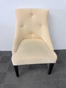 Light Beige Upholstered Side Chair with Button Tufting and Dark Wood Legs
