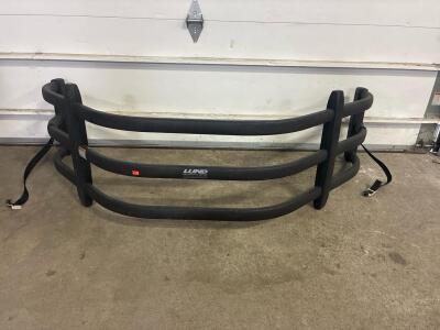 Lund brand black tube truck bed extender.