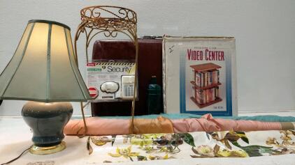 Vintage Table Lamp, Revolving Video Center, Plant Stand, Security Kit, Briefcase, Fabric Rolls Lot