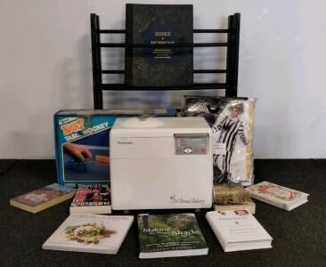 Panasonic SD-BT2P Bread Maker, shoe rack, Beetlejuice costume(XXL), nerf table hockey, and books.
