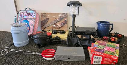 Large Mixed Lot: Disney Backpack, Citizen Knife Set, RCA Box (missing power cord), Puzzles, Dominoes, Sunglasses