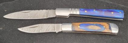 (2) Blue & Blue Wood-Toned Custom Damascus Steel Folding Pocket Knives with Resin and Wood Handles, Leather Sheaths