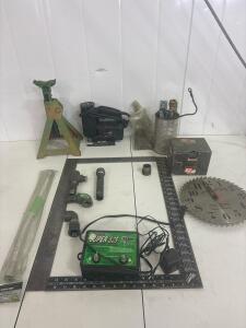 Craftsman scroller saw, a sears saw blade shop clock, Fi-Shock Inc. electric fence energizer, model SS-525, (2) 90 degree squares. Automotive jack, Miscellaneous screws and pipe fittings, and much more