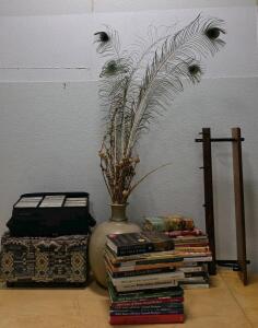 Cookbooks & Annuals Lot, Ceramic Vase with Peacock Feathers, CD Case, Fabric Bin, Wooden Stand