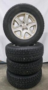 Cooper Evolution Winter 235/70R16 Studded Tires on Jeep 16" 5-Lug Alloy Wheels Set of 4
