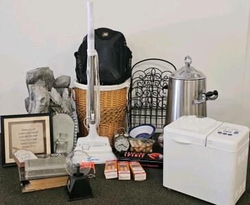 Mixed Kitchenware and Rustic Decor Lot: Steamfast Steam Mop (Functional), America's Favorite Bread Maker (Functional), Metal Coffee Stand, Metal Magazine Rack, Driftwood Fountain Decor (Could Not Confirm Functional), Wicker Laundry Basket, Black Camera Ca