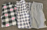 (XA) Mixed Clothing Lot: Paper Shredder w/ Forward and Reverse Modes (Functional), Large Green and Orange Quilt, JNCO Shorts, Jean Shorts, Various Brands of Jeans, Various Dallas Cowboys Shirt and Vest, Other Clothing in Various Sizes, Moccasins, Two Bags - 7