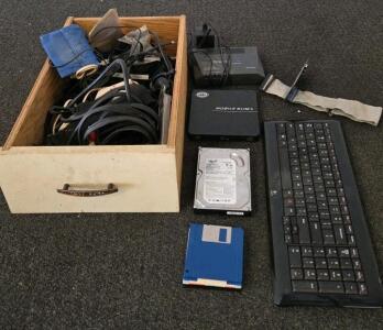 Mixed Vintage Computer Lot: Seagate HDD, Actiontec DSL Modem, Logitech Keyboard, Cables/Headphones (XA)