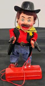 Vintage Battery-Operated Remote-Controlled Cowboy Toy with Dual Pistols and Wired Controller