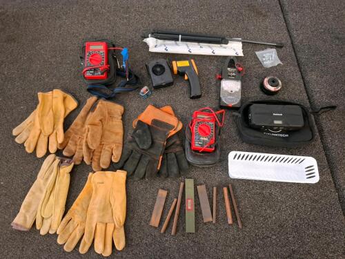 Large Lot Automotive Diagnostic Tools, OBDII Scanners, ( powered on) Clamp Meters, Multimeters, Gloves