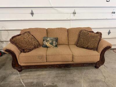 Traditional Three-Seat Sofa with Carved Wood Accents, Light Brown Fabric Upholstery