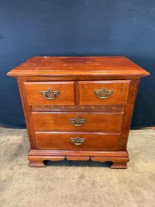 Traditional Wooden 4-Drawer Dresser with Ornate Brass Handles and Decorative Inlay