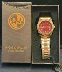 AJ Analog Gold-Tone Men's Watch, Red Sunburst Dial, Date Magnifier, Crystal Hour Markers in Box