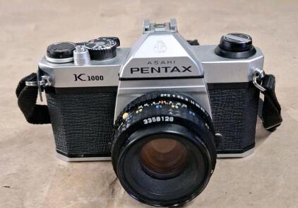 (1) Vintage Asahi Pentax K1000 35mm SLR Film Camera Equipped W/ A Manual Focus 50mm Lens