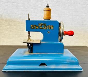 Kay an EE Sew Master Toy Sewing Machine, Circa 1950s, Hand-Crank, Blue Metal Body (7"x4"x5")