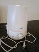 Vicks humidifier ( powered on( holmes heater( powered on) Decorative Metal Wire Fruit Bread Basket, Unique Pottery, Alarm Clocks, Wok, Frying Pan, VHS Tapes, And More - 2