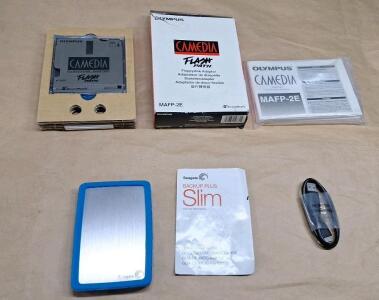 (1) Seagate Backup Plus Portable USB Drive 2TB Silver W/ Blue Rubber Case & USB Cable & (1) Olympus MAFP-2E Flash Path Floppy Disc Adapter For SmartMedia Cards NOS