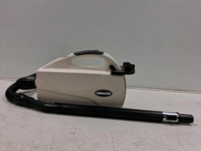 Oreck Portable Canister Vacuum, Compact Design, Lightweight, 870W, Attachments, 20 ft Cord (Turns On)