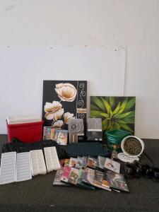 Big mixed lot, coleman cooler, wall art, yoga and exercise dvds. Duffel bag, ice trays, bucket of nails. And more