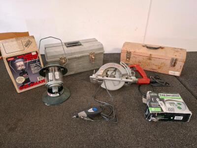 Slill saw, powered on) Coleman lantern, dremmel, tire Inflator. Plastic Toolbox and metal tool box. ( shelf E)