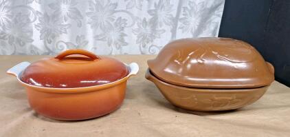 (1) Vintage 9" Cast Iron Orange Enamel Lidded Oval Dutch Oven & (1) Vintage 9" Glazed Terra Cotta Roaster Baking Dish W/ Lid, Embossed W/ Cow, Chicken & Fish